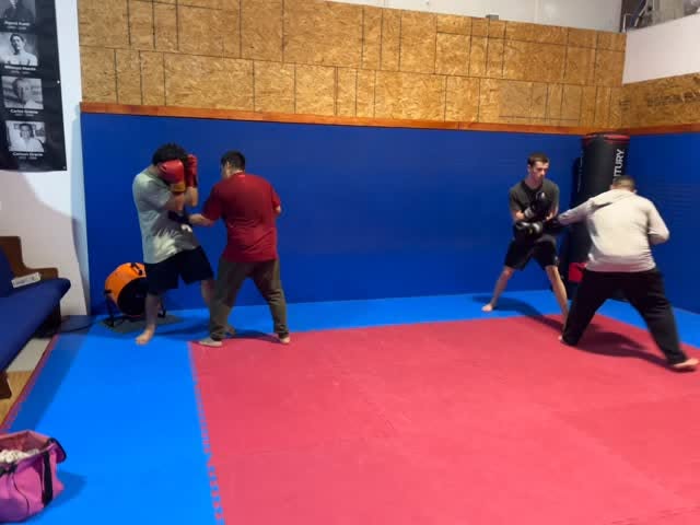 Striking drills on the mats during MMA class in Kemah, TX